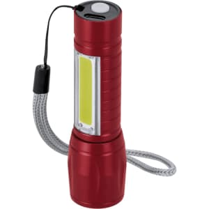 A red torch with a USB charging port and a textured grip, featuring a strap and a bright light panel.
