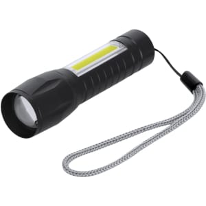 A compact black torch with a textured body and a wrist strap, featuring a bright LED light and a clear lens.