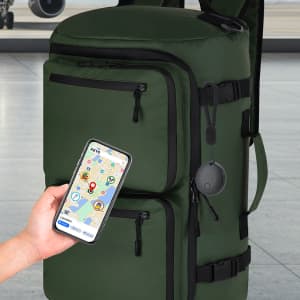 A green backpack with multiple zippers and a phone displaying a map, featuring a tracking device attached.