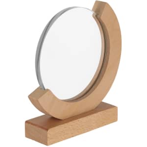 A circular clear plaque with a wooden base, featuring a smooth, polished finish and a minimalist design.