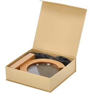 A round plaque with a wooden frame, presented in a beige box with black cushioning.