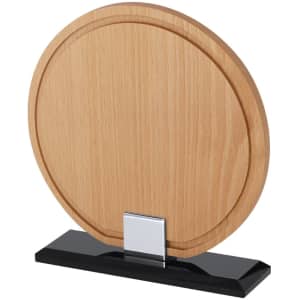 A round wooden plaque with a sleek black base, featuring a metal holder for display.