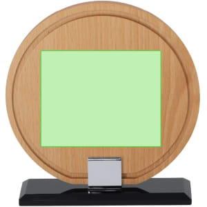 A rounded wooden plaque with a green insert and a black base. Features a simple logo on the front.