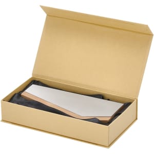 A gold box containing a sleek, rectangular plaque with a wooden edge, resting on black fabric.
