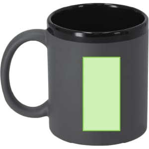 A coffee mug in black with a glossy finish and a light green rectangular area. It features a logo.