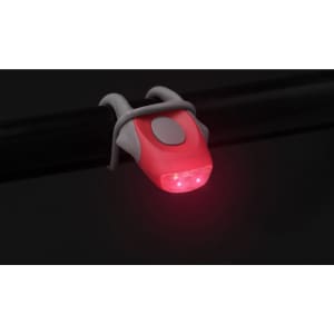 A red bike safety light secured to a black pole, featuring a grey button and a sleek design.