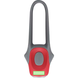 A red and grey bike safety light features a rounded shape with a green illumination section and a logo.