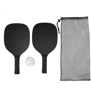 Two black pickleball rackets, a white perforated ball, and a black mesh storage bag.