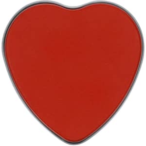 A heart-shaped red candle with a metallic grey rim.