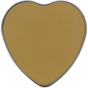 A heart-shaped aromatic candle in a warm gold colour, contained in a silver tin.