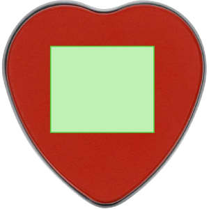 A heart-shaped candle in red with a blank green label in the centre, featuring a sleek silver rim.