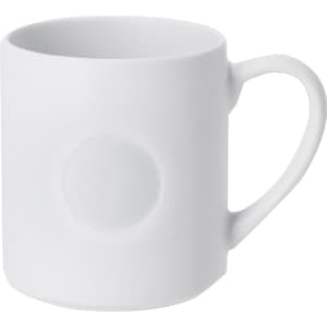 A white coffee mug with a smooth finish and a textured circular feature on the side.
