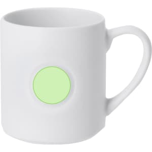 A white coffee mug with a green circular area for branding. Simple and elegant design.
