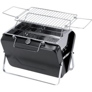 A portable black barbecue grill with chrome legs and a hinged lid showcasing the cooking rack and charcoal compartment.