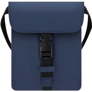 A navy shoulder bag with a snap closure and adjustable strap, featuring a logo on the front.