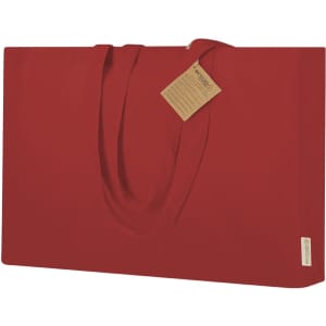 A large red tote bag with long handles and a tag attached. It features a simple, sleek design.
