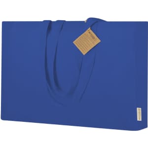 A blue tote bag with two handles and a tag attached. It features a simple, solid design.