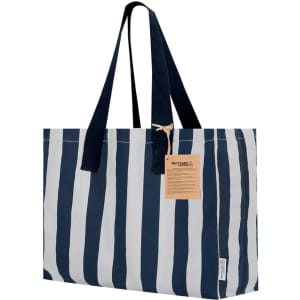 A striped tote bag in navy blue and white with a sturdy handle and a branded tag attached.