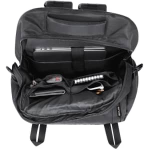 A black backpack interior featuring a laptop compartment, pockets for accessories, and minimalistic design.