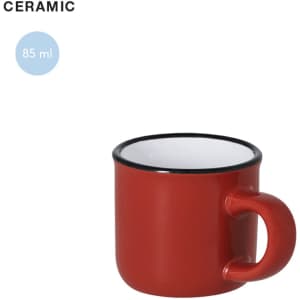 A red ceramic mug with a black rim and a handle, holding 85 ml of liquid. Features a logo.