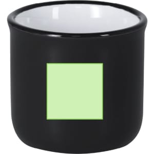 A coffee mug in black with a contrasting white interior and a square area for customisation.