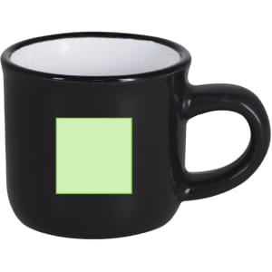 A black coffee mug with a green square design on the front and a handle.