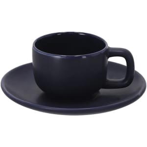 A coffee mug set in deep navy blue with a matching saucer. The mug features a sturdy handle and a smooth finish.