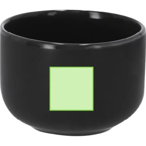 A black coffee mug featuring a green square design and a smooth, glossy finish.