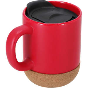 A red travel mug with a black lid and a cork base, featuring a rounded handle and a sleek design.
