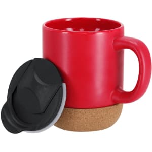 A red travel mug with a cork base and a black lid. The mug has a sturdy handle and a sleek design.