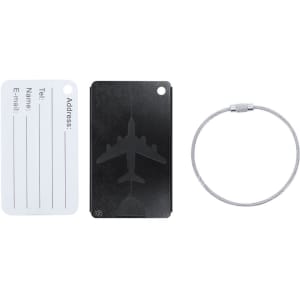 A luggage tag featuring a black design with an airplane silhouette, accompanied by a metal securing ring.