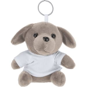 A grey teddy bear keyring with a white T-shirt and a metal keyring attachment. It has a cute, soft appearance.