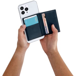 A phone wallet in navy blue, held open with a card slot and a space for a phone, displaying a card inside.