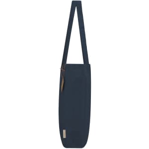 A navy tote bag with a single strap and a small tag. It features a minimalistic design and has a logo.