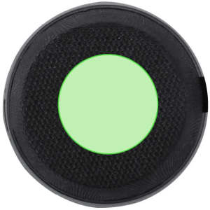 A round black speaker with a green centre, featuring a textured surface and a logo on the side.