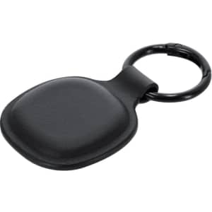 A black tracking device with a smooth, rounded shape attached to a metal keyring.