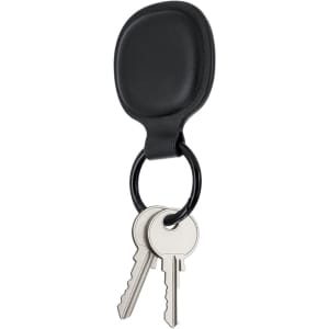 A black key fob attached to a keyring with two silver keys. The fob has a rounded shape.