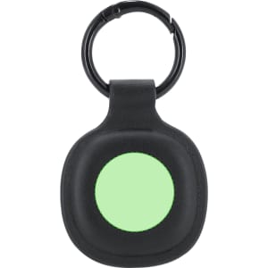 A black tracking device with a light green circular centre, featuring a keyring attachment.