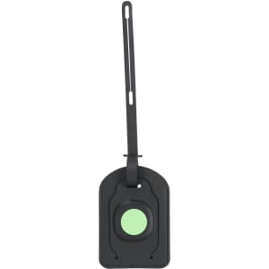A black luggage tag with a circular mint green centre and an adjustable strap. It features a logo.