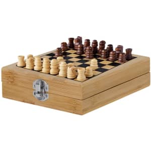 A wooden chess set with light and dark pieces displayed on a checkered board, housed in a bamboo box with a metal clasp.