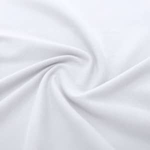 A close-up view of white fabric, showcasing its smooth texture and soft drape.