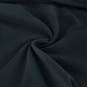 A dark navy fabric with a smooth texture, displaying a subtle pattern and slight sheen.