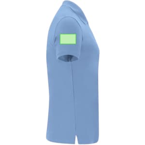 A side view of a light blue women's polo shirt featuring a green patch on the sleeve.