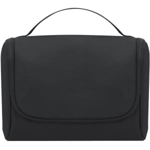 A black toiletry bag with a fold-over flap and a carry handle, featuring a smooth surface and a subtle logo.