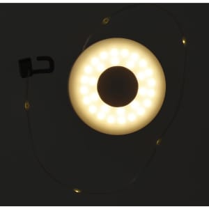 A round LED light with a warm yellow glow, featuring a hook and a flexible light string.