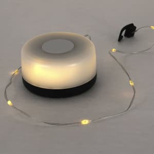 A round LED light in white with a black base, featuring a string of warm white fairy lights.