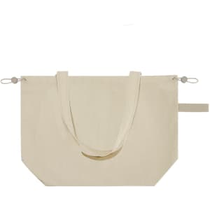 A large beige drawstring bag with handles and a logo, featuring a bottom corner detail.