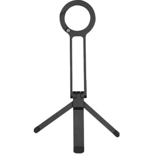 A black phone stand with a circular holder and adjustable tripod legs. Features a simple, minimalist design.