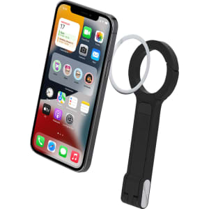 A black phone stand with a circular holder, displayed alongside a smartphone featuring a vibrant screen.