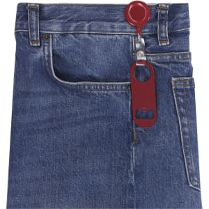 A drink bottle opener in burgundy attached to denim jeans, featuring a circular top and bottle cap opener.